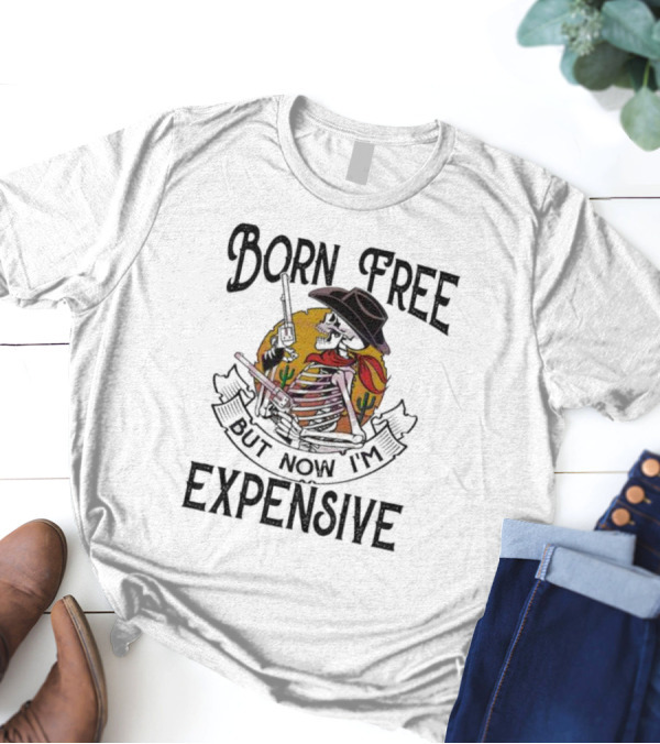 Skeleton Cowboy Born Free But Now I'm Expensive With Gun And Cactus Background T-Shirt