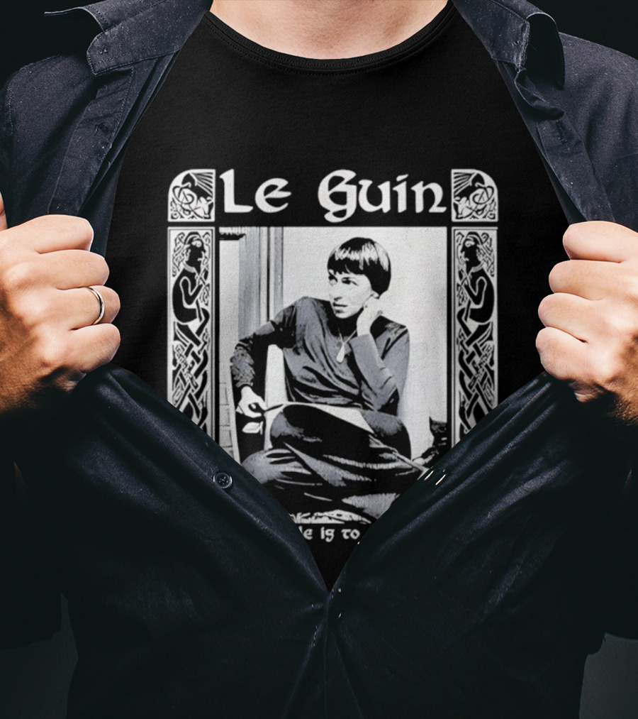 Le Guin To Light A Candle Is To Cast A Shadow T-Shirt