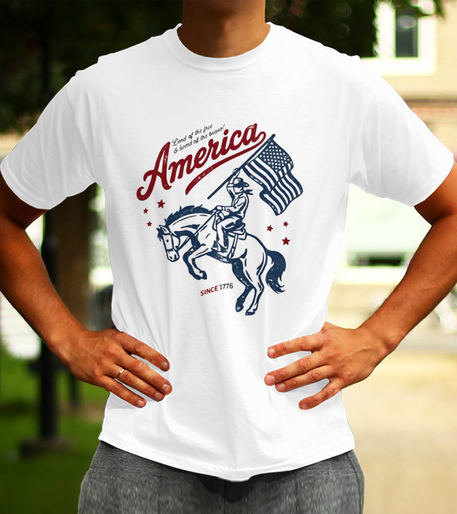 America Land Of The Free Home Of The Brave Since 1776 Cowboy Holding Flag Patriotic T-Shirt
