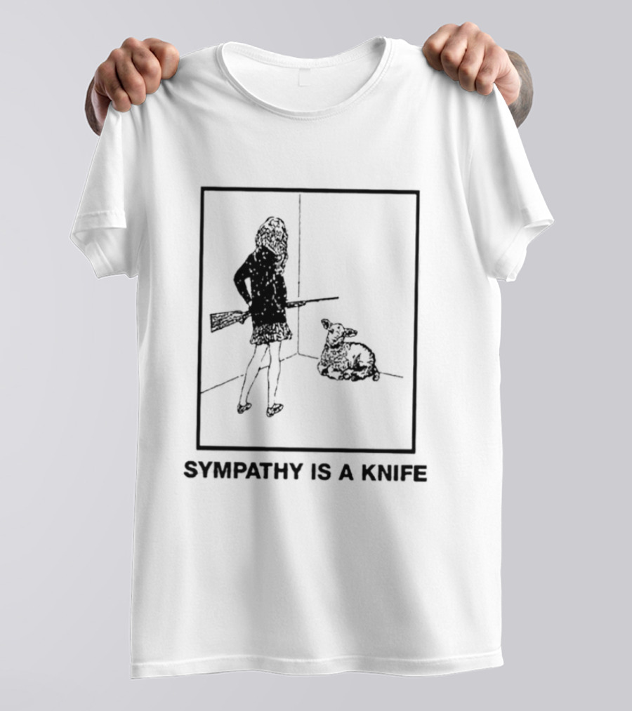 Sympathy Is A Knife Dark Silhouette Holding Object Next To Seated Figure T-Shirt