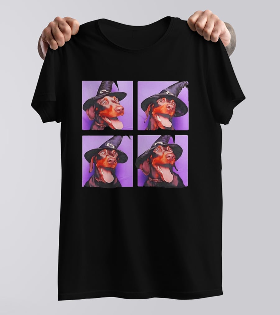 Doberman Pinscher In Witch Hat For Halloween With Purple T-Shirt