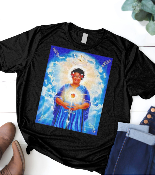 Stacey Abrams Patron Saint Of Fairness In Voting With Scales Of Justice Halo And Glowing Apple In Celestial Clouds T-Shirt
