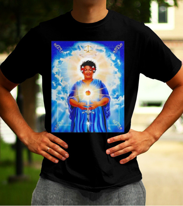 Stacey Abrams Patron Saint Of Fairness In Voting With Scales Of Justice Halo And Glowing Apple In Celestial Clouds T-Shirt