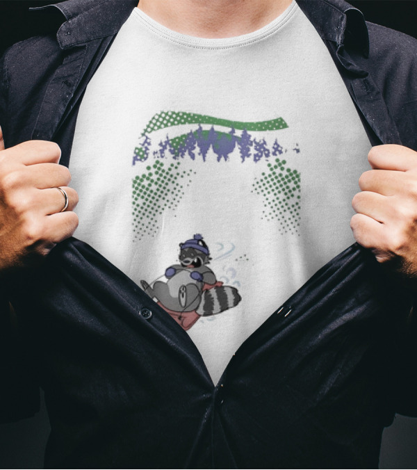Raccoon Sledding In Winter Forest Scene With Evergreen Trees And Snowflakes T-Shirt