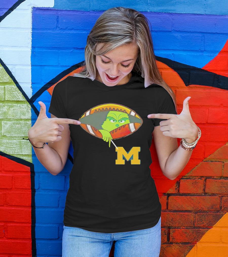 Grinch Peeking From Football Over Michigan Wolverines T-Shirt