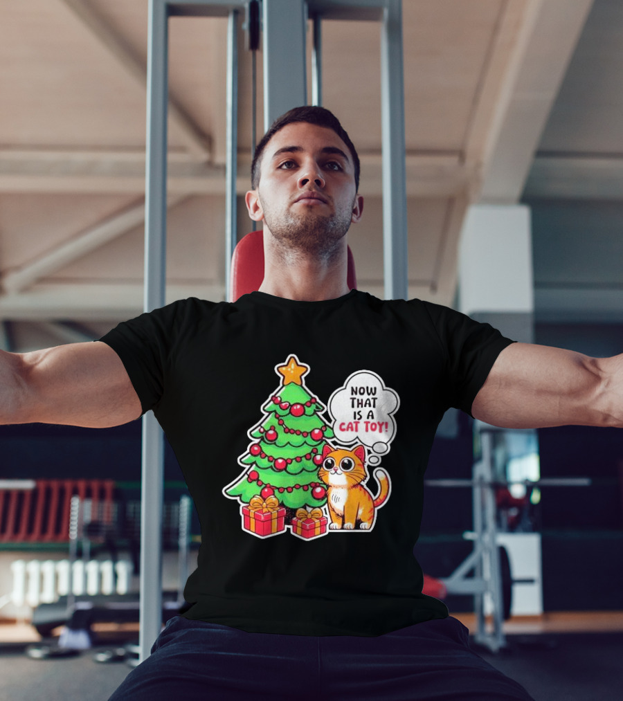 Now That Is A Cat Toy A Cute Orange Cat With Wide Eyes Next To Decorated Christmas Tree T-Shirt